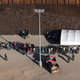 YUMA, ARIZONA - SEPTEMBER 28: Immigrants await processing by U.S. Border Patrol agents while seeking asylum in the United States on September 28, 2022, near Yuma, Arizona. U.S. immigration authorities made more than 2 million arrests along the U.S. southern border during the 2022 fiscal year, which ends September 30, the first time to reach that historical threshold.